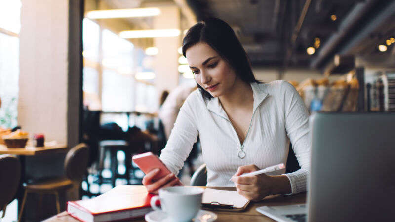 female sitting and browsing the phone